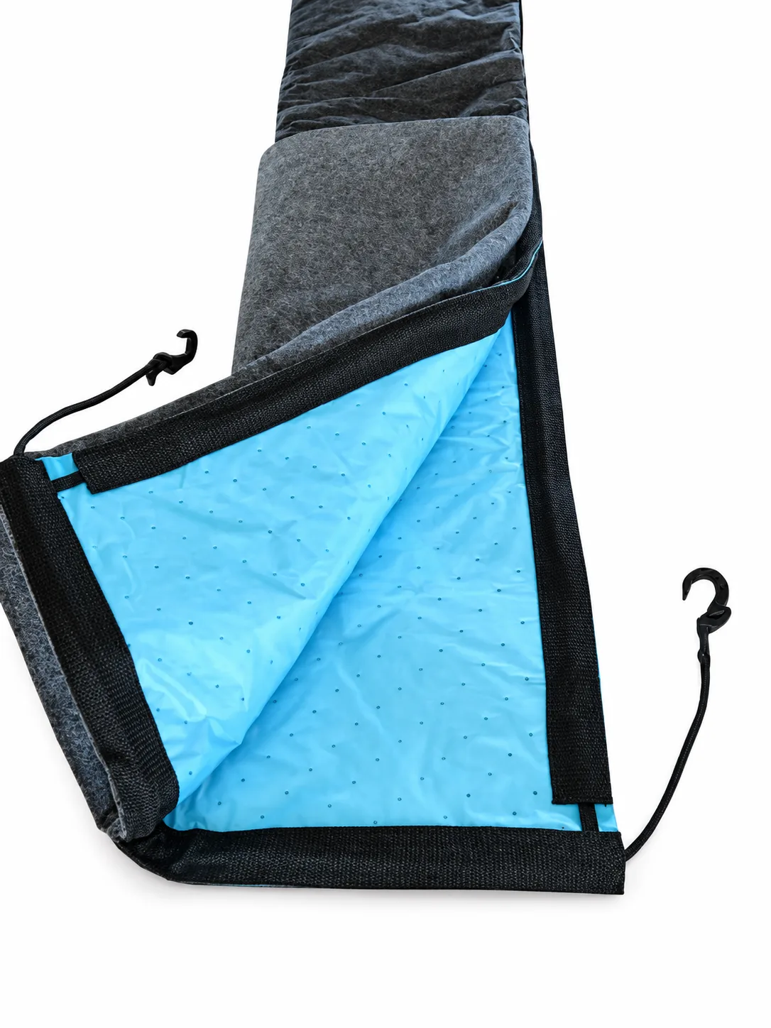 Folded Spill Diaper showing its gray absorbent face, blue backing, black binding, and visible hooked cords